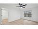 Light-filled bedroom boasts a ceiling fan, wood-look floors, and a walk-in closet at 1504 Galloway Ln, Charleston, SC 29412