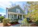 Charming two-story home with a welcoming front porch and lush landscaping at 1504 Galloway Ln, Charleston, SC 29412