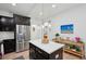 This kitchen boasts a center island with stone countertops and stainless steel appliances at 1504 Galloway Ln, Charleston, SC 29412