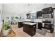 The kitchen offers a large island, stainless appliances, and a breakfast area with plenty of natural light at 1504 Galloway Ln, Charleston, SC 29412
