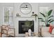 Bright living room with fireplace, comfortable seating, and a large window for natural light at 1504 Galloway Ln, Charleston, SC 29412