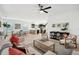 Open-concept living area with hardwood floors, modern furnishings, and abundant natural light at 1504 Galloway Ln, Charleston, SC 29412