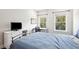 Bedroom features hardwood floors, natural light, desk, and a black metal bedframe at 1537 Cultivation Ln, Mount Pleasant, SC 29466