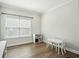 Bright bonus room with a white storage unit, small table and wood grain flooring at 1537 Cultivation Ln, Mount Pleasant, SC 29466