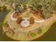 Aerial view of community park featuring a fire pit, walking paths, mature trees, and benches at 1537 Cultivation Ln, Mount Pleasant, SC 29466