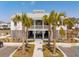 Attractive exterior showcasing palm trees, a covered seating area, and manicured landscaping at 1537 Cultivation Ln, Mount Pleasant, SC 29466
