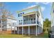 Inviting two-story home featuring a spacious screened-in porch and well-kept yard at 1537 Cultivation Ln, Mount Pleasant, SC 29466
