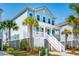 Beautiful coastal home featuring a covered porch with double garages and professional landscaping at 1537 Cultivation Ln, Mount Pleasant, SC 29466