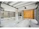 Bright garage with concrete columns, wood slats, and a convenient plywood storage area at 1537 Cultivation Ln, Mount Pleasant, SC 29466