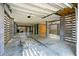Spacious garage with concrete columns, horizontal slats, and a plywood storage area at 1537 Cultivation Ln, Mount Pleasant, SC 29466