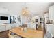 Spacious kitchen, dining area, and staircase visible from entry; open concept design with modern fixtures at 1537 Cultivation Ln, Mount Pleasant, SC 29466