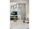 Close-up shot of kitchen island with stainless steel sink, faucet, decorative lighting, and built-in microwave at 1537 Cultivation Ln, Mount Pleasant, SC 29466