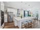 Modern kitchen with a large island, stainless steel appliances, and stylish bar stools, perfect for entertaining at 1537 Cultivation Ln, Mount Pleasant, SC 29466