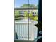 Lake view with fountain, seen through a window with white railing in foreground at 1537 Cultivation Ln, Mount Pleasant, SC 29466