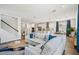 Spacious living room with an open floor plan that connects to the modern kitchen and dining area at 1537 Cultivation Ln, Mount Pleasant, SC 29466