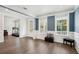 Inviting living room with hardwood floors, bright windows, and stylish seating, offering a cozy and elegant space at 1537 Cultivation Ln, Mount Pleasant, SC 29466