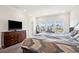 Bright main bedroom with large windows, wood floors, and a lake view at 1537 Cultivation Ln, Mount Pleasant, SC 29466