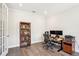 Functional office space with natural light, equipped with a desk setup and bookshelves, ideal for a home office at 1537 Cultivation Ln, Mount Pleasant, SC 29466