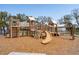 Well-equipped wooden playground featuring slides, climbing structures, and a soft mulch surface for safe and active play at 1537 Cultivation Ln, Mount Pleasant, SC 29466