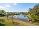 Aerial view of a pond and its fountain surrounded by community homes at 1537 Cultivation Ln, Mount Pleasant, SC 29466