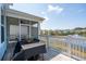 A screened-in porch with a view of the community's pond and fountain at 1537 Cultivation Ln, Mount Pleasant, SC 29466