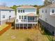 Charming two-story coastal home featuring a spacious rear porch and a well-maintained backyard at 1537 Cultivation Ln, Mount Pleasant, SC 29466