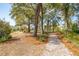 Scenic walking path through a community park surrounded by lush trees and landscaping near beautiful residential homes at 1537 Cultivation Ln, Mount Pleasant, SC 29466