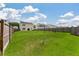 Spacious backyard with lush green grass, surrounded by a wooden fence at 163 Cypress Plantation Rd, Moncks Corner, SC 29461