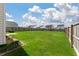 Large backyard featuring a lush lawn, and a fenced perimeter for privacy at 163 Cypress Plantation Rd, Moncks Corner, SC 29461
