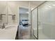 Bathroom featuring a quartz countertop vanity, tiled floors, and a glass shower with a seat, leading to bedroom at 163 Cypress Plantation Rd, Moncks Corner, SC 29461