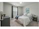 Cozy bedroom with neutral walls, a comfortable bed, and a window with curtains, perfect for relaxation at 163 Cypress Plantation Rd, Moncks Corner, SC 29461