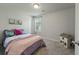 Cozy bedroom features a comfortable bed, natural light from a window, and neutral wall color at 163 Cypress Plantation Rd, Moncks Corner, SC 29461