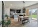 Bright dining area adjacent to a kitchen with stainless steel appliances at 163 Cypress Plantation Rd, Moncks Corner, SC 29461