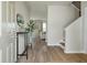 Inviting entryway with hard wood floors and view of the living room beyond at 163 Cypress Plantation Rd, Moncks Corner, SC 29461