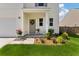 Up-close view of the home's entrance, showcasing a well-maintained lawn and tasteful decor at 163 Cypress Plantation Rd, Moncks Corner, SC 29461