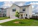 Charming two-story home with a well-manicured lawn and inviting front porch at 163 Cypress Plantation Rd, Moncks Corner, SC 29461