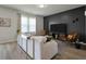 Bright living room featuring large windows and stylish furniture at 163 Cypress Plantation Rd, Moncks Corner, SC 29461