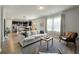 Bright and airy living room with hardwood floors that flows into a modern kitchen at 163 Cypress Plantation Rd, Moncks Corner, SC 29461