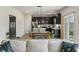 Living space with kitchen view with pendant lights and hardwood floors at 163 Cypress Plantation Rd, Moncks Corner, SC 29461