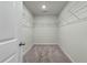 Walk-in closet with carpet flooring, wire shelving, and ample space for storage, providing organization at 163 Cypress Plantation Rd, Moncks Corner, SC 29461