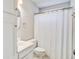 Cozy bathroom with white cabinets and a shower with white shower curtain at 1708 Eallystockert Rd, Charleston, SC 29414