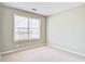A bright bedroom featuring neutral walls and a large window allowing for plenty of natural light at 1708 Eallystockert Rd, Charleston, SC 29414