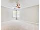 A cozy bedroom with ample natural light from corner windows and a ceiling fan at 1708 Eallystockert Rd, Charleston, SC 29414