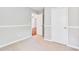 Cozy bedroom with neutral walls and a view into hallway at 1708 Eallystockert Rd, Charleston, SC 29414