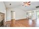 Open living room with hardwood floors, vaulted ceiling and brick fireplace at 1708 Eallystockert Rd, Charleston, SC 29414