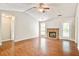 Inviting living room with vaulted ceilings, wood floors, and a cozy brick fireplace at 1708 Eallystockert Rd, Charleston, SC 29414