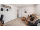 Comfortable bonus room has a couch, a trunk, a collection of hats, and an entry to another room at 1723 Indaba Way, Charleston, SC 29414