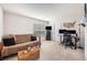 Spacious bonus room has neutral walls, carpet, a window, a sofa, a TV stand, and a desk at 1723 Indaba Way, Charleston, SC 29414