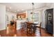 Cozy dining area with hardwood floors, stylish lighting, and seating for four at 1723 Indaba Way, Charleston, SC 29414