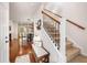 Inviting foyer with hardwood floors and carpeted stairs leading to the second floor at 1723 Indaba Way, Charleston, SC 29414
